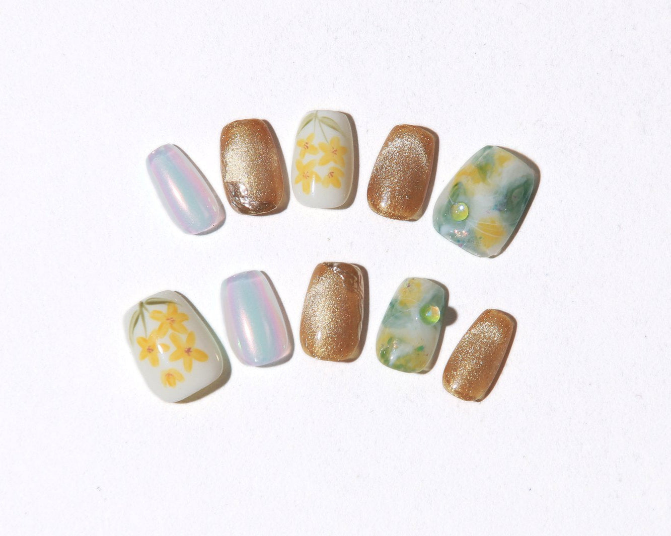 ootd.nail イエローフラワー ジェルネイルチップ｜手描き風の黄色い花とマーブル、ゴールド、オーロラの輝きが融合した華やかデザイン。春夏にぴったりの繰り返し使えるネイルチップ。